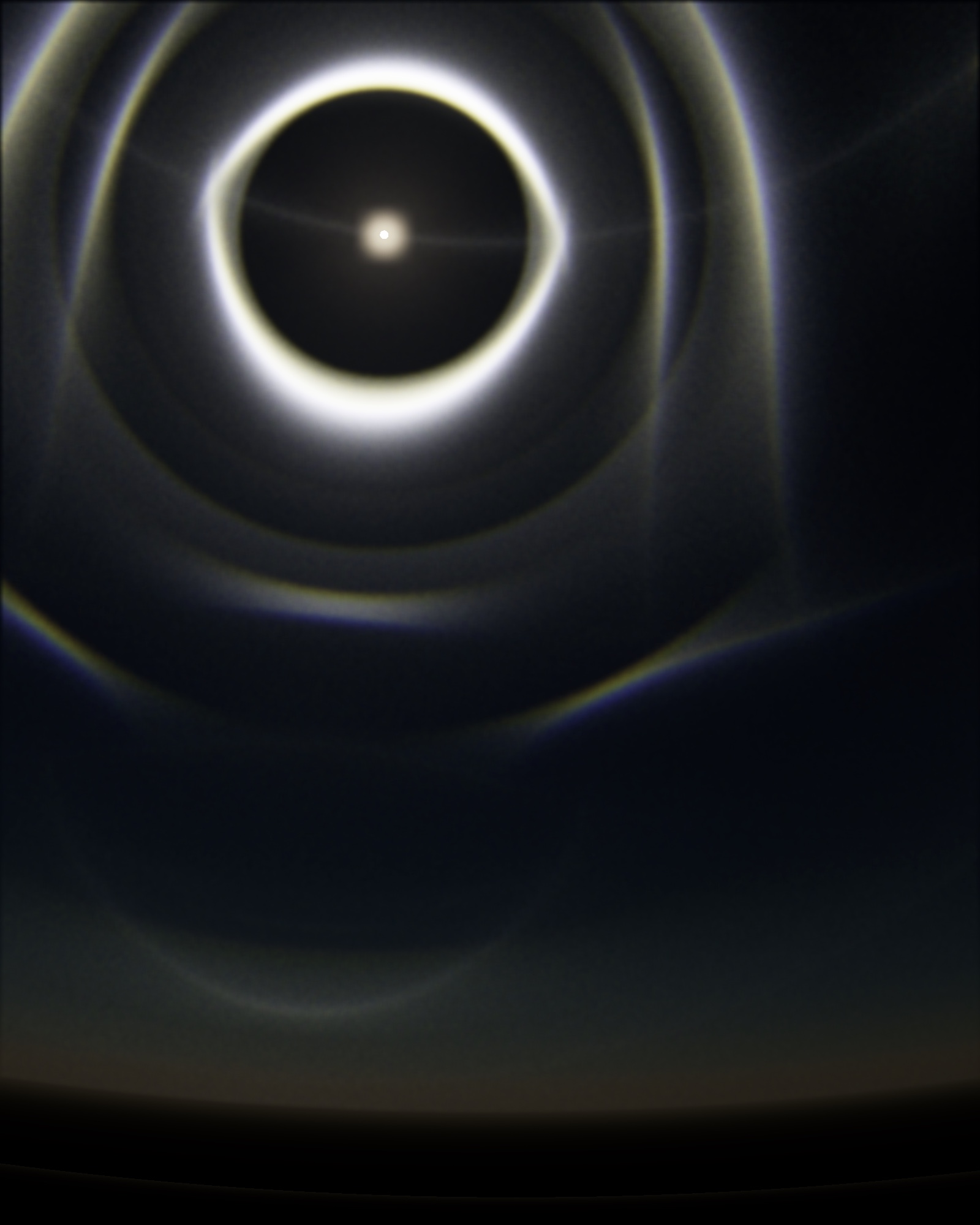 PARHELION plate 13 — a tiny brilliant sun in a near-black sky, surrounded by one sharp white ring and several fainter concentric rings fading into the dark. A thin horizontal line of light crosses the sky through the sun. The bottom of the frame holds a narrow band of dim warm light at the horizon.