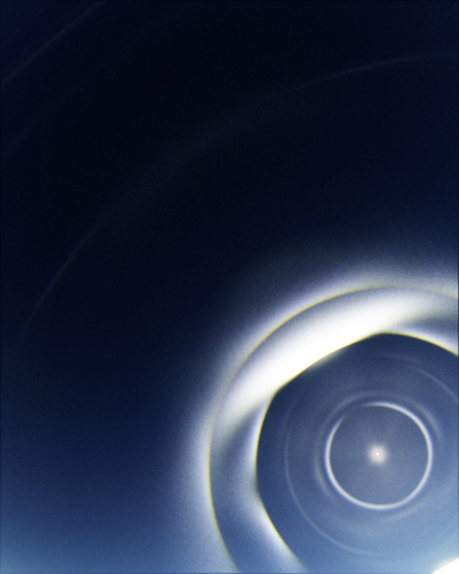 PARHELION plate 34 — a bright sun ringed by several tight concentric halos, with a broad arc sweeping across a deep blue sky.
